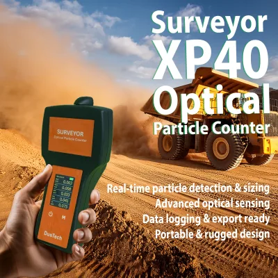 Surveyor-XP40-Dust-Monitor Handheld optical particle counter in a dusty quarry, with a yellow dump truck and large dust plume in the background